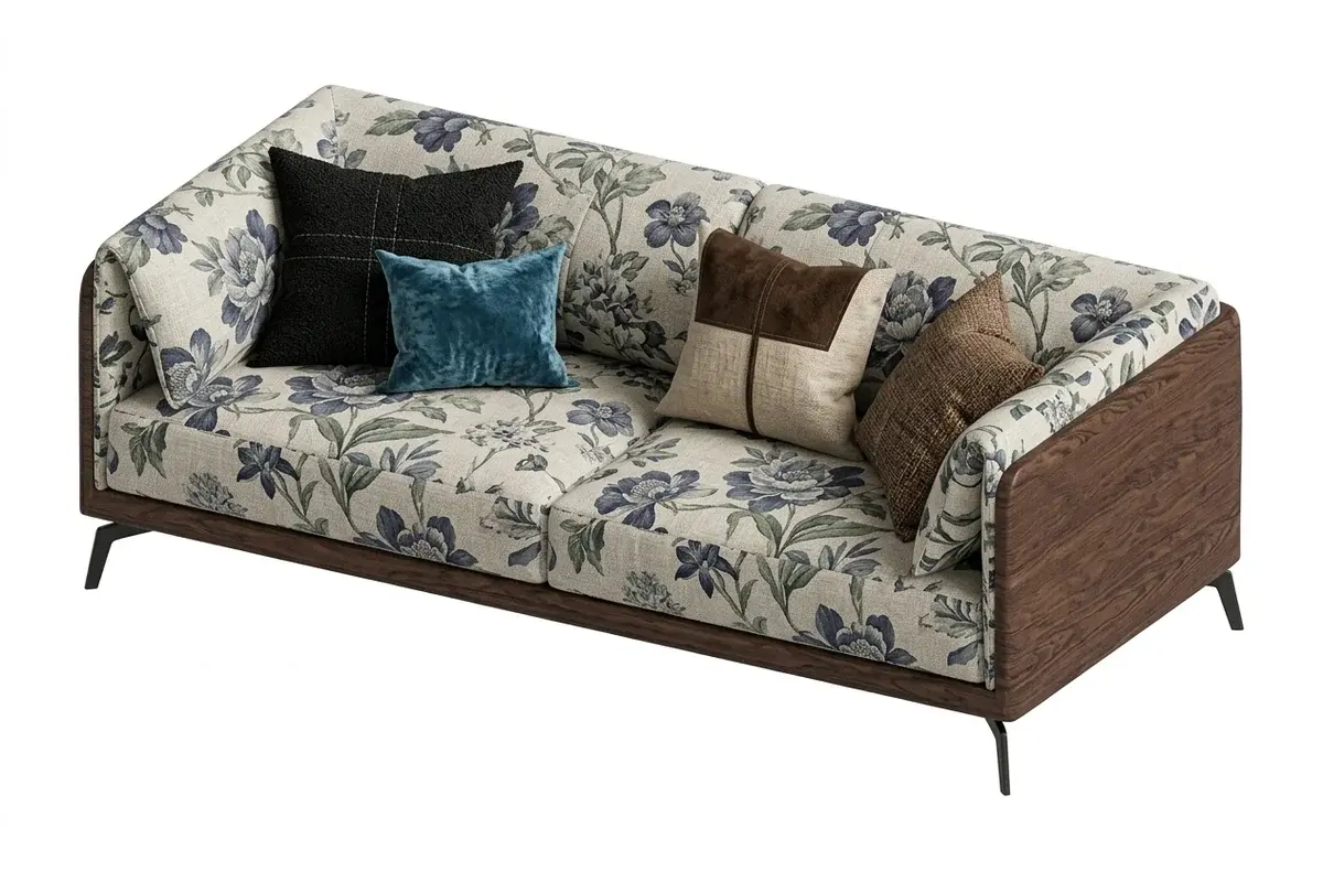 A sofa in a blue floral fabric with accent pillows and a wood frame, imported into Revit with its textures